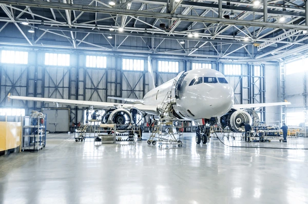 passenger-airplane-on-maintenance-engine-600nw-1043665888